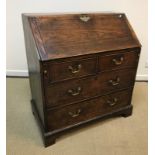A 19th Century ash bureau, the plain top over a sloping fall enclosing a basic fitted interior,