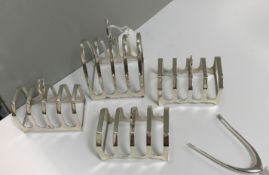 A pair of silver four section toast racks (by H F Adams and Holman, Birmingham 1937),