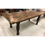 A refectory style dining table, the elm plank top with cleated ends,