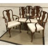 A set of eight early to mid 20th Century walnut framed dining chairs in the Queen Anne style with