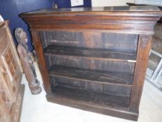 An oak three tier bookcase raised on a plinth base, 118 cm wide x 31 cm deep x 101 cm high,