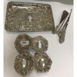 An Edwardian silver tray with embossed scrolling decoration (Birmingham 1902),