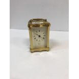 A modern Rapport brass cased carriage clock in the Victorian style, 11.5 cm high x 8 cm wide x 7.