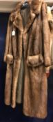 A pale brown full length mink coat, bearing label to the interior "H.