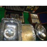 A collection of plated wares comprising an entree dish, swing handled basket, twin-handled tray,