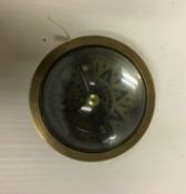 A modern brass and glass reproduction navigating compass / magnifier