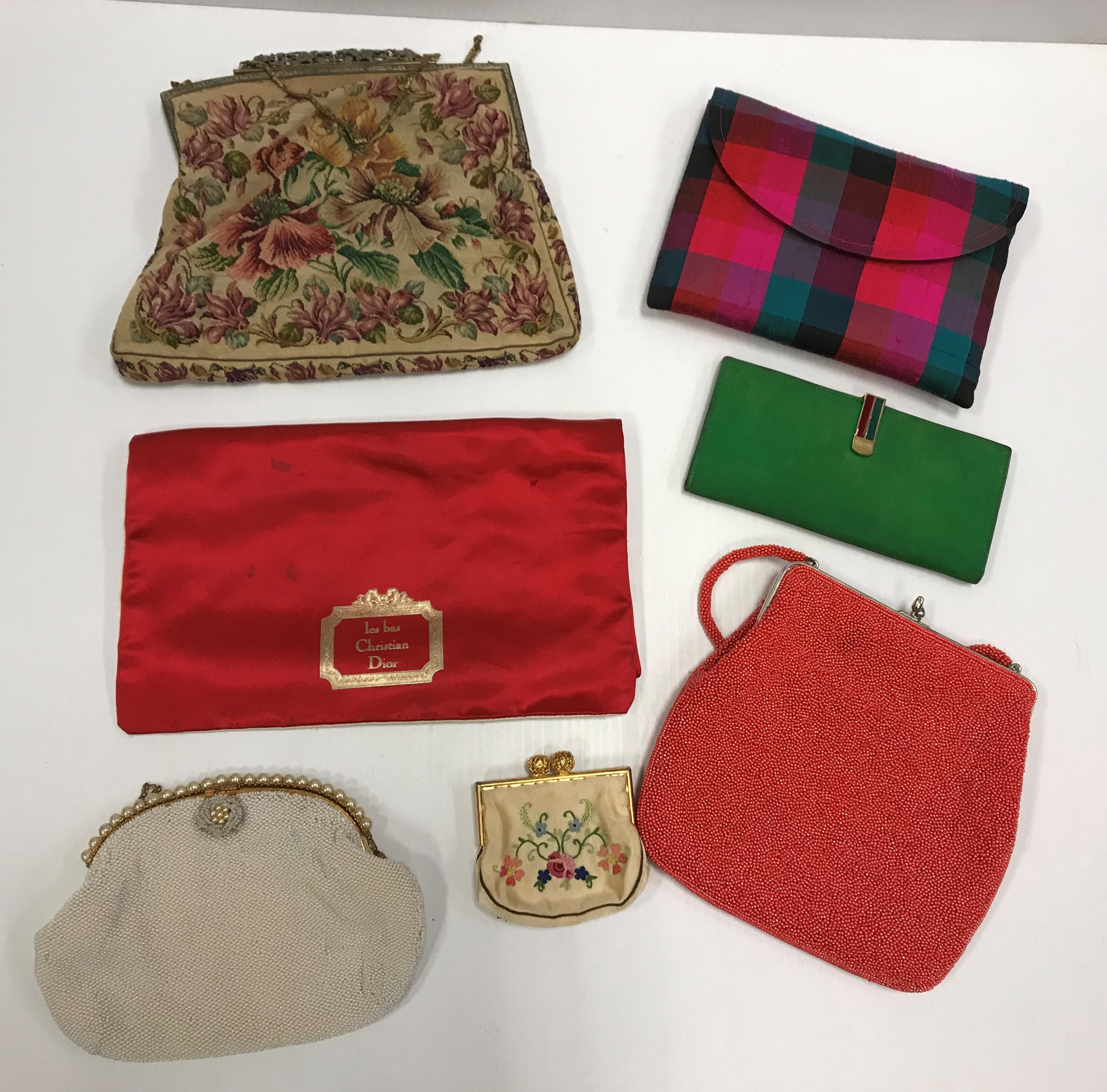 A collection of evening bags to include two beaded examples and an Austrian tapestry example