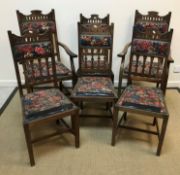 A set of six circa 1900 mahogany dining chairs in the Arts and Crafts style with upholstered back