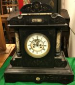 A late Victorian slate and marble cased mantel clock with gilt lined scrolling foliate decoration,