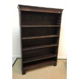 A mahogany adjustable bookcase, the top with dentil decoration, raised on bracket feet, 122.