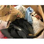 A box containing assorted table linens,