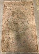 A Chinese silk rug, the pale pink,