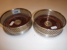 A pair of modern silver wine coasters with pierced decoration (Birmingham 2000), 12.