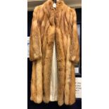 A light brown fox fur coat with sateen lining,