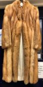 A light brown fox fur coat with sateen lining,