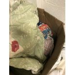 A box of various curtains and clothing,