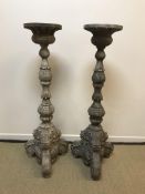 A pair of carved wood and painted candle stands in the 17th Century Italianate manner, 152.