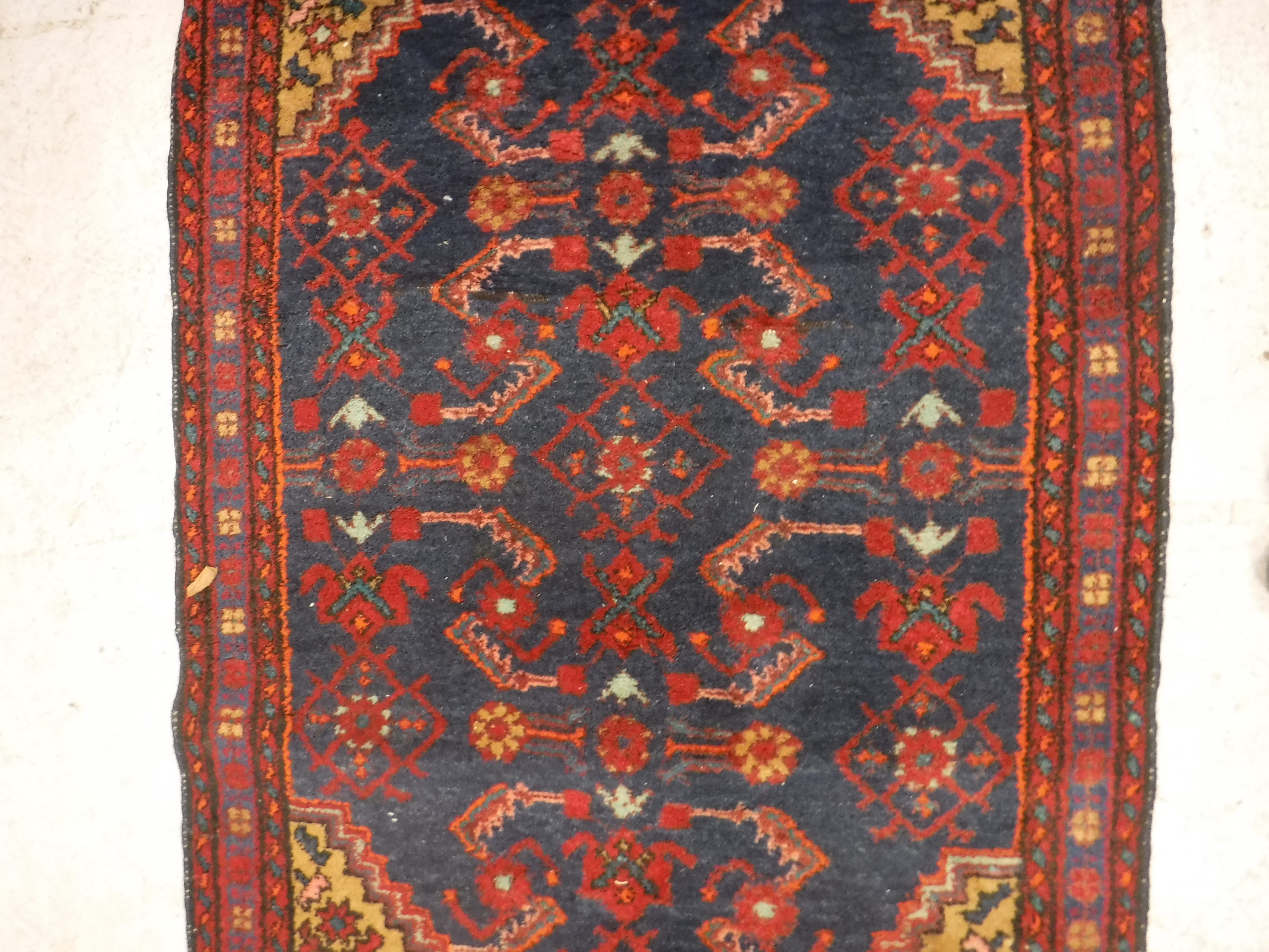A Caucasian rug, the central panel set with stylised floral decoration on a blue ground, - Image 3 of 4