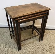 An Edwardian mahogany nest of three graduated occasional tables,