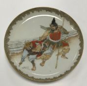 A Meiji period Japanese satsuma plate polychrome decorated with Samurai soldiers, 22 cm diameter,