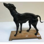 A modern bronze figure of a "Greyhound or Whippet in standing position with ornate foliate