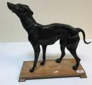 A modern bronze figure of a "Greyhound or Whippet in standing position with ornate foliate