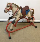 A Tri-ang rocking horse on red painted tubular base (for restoration),