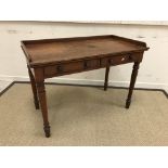 A Victorian mahogany washstand with three quarter galleried top over two frieze drawers,