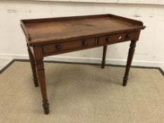 A Victorian mahogany washstand with three quarter galleried top over two frieze drawers,