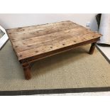 A modern Indian hardwood and iron embellished coffee table, the rectangular top on turned legs,