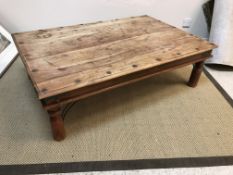 A modern Indian hardwood and iron embellished coffee table, the rectangular top on turned legs,