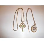 A 9 carat gold seed pearl and peridot set pendant in the Art Nouveau manner with 9 carat gold chain,