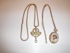 A 9 carat gold seed pearl and peridot set pendant in the Art Nouveau manner with 9 carat gold chain,