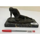 A Continental patinated bronze figure of "The Fallen Gaul Gladiator" on an oval base, 15.