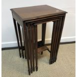 An Edwardian mahogany inlaid quartetto of tables, raised on square tapered legs to spade feet,