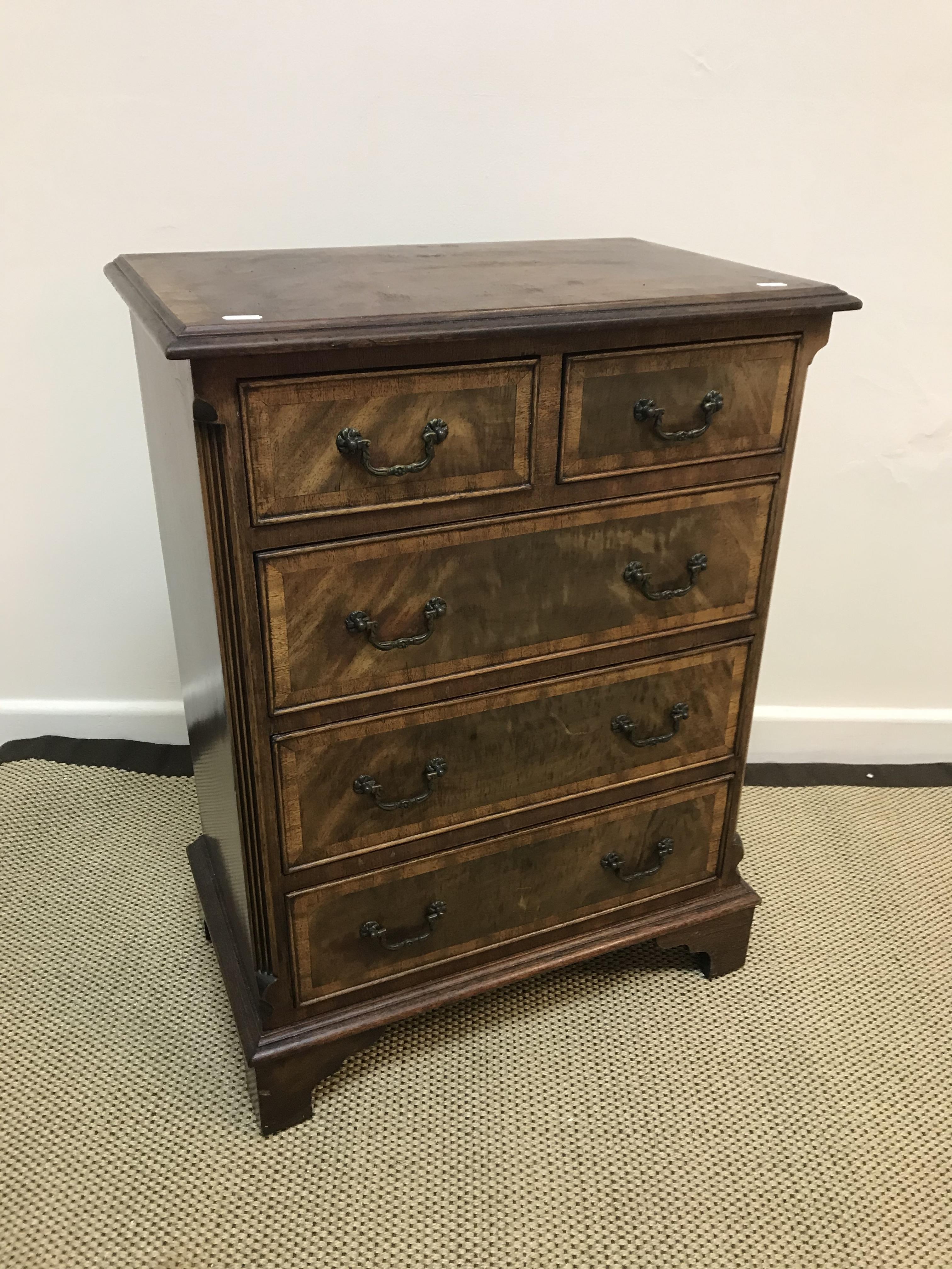 A modern mahogany and cross-banded chest in the Georgian style,