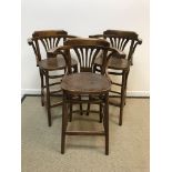 A set of three mahogany bentwood bar stools in the early 20th Century style with panelled seats on