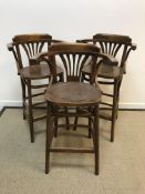 A set of three mahogany bentwood bar stools in the early 20th Century style with panelled seats on