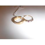 An 18-carat gold wedding band and an 18-carat gold diamond and ruby set dress ring, 6.