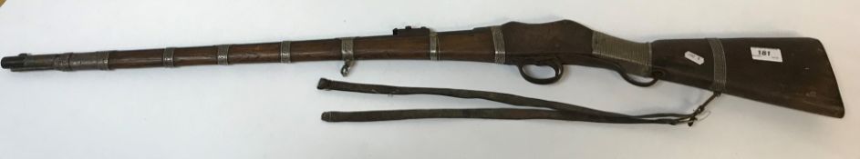 A 19th Century Martini Henry Action rifle with later white metal embellishments (de-activated), 114.