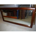 A mahogany framed rectangular wall mirror, 67 cm wide x 137 cm long x 3.