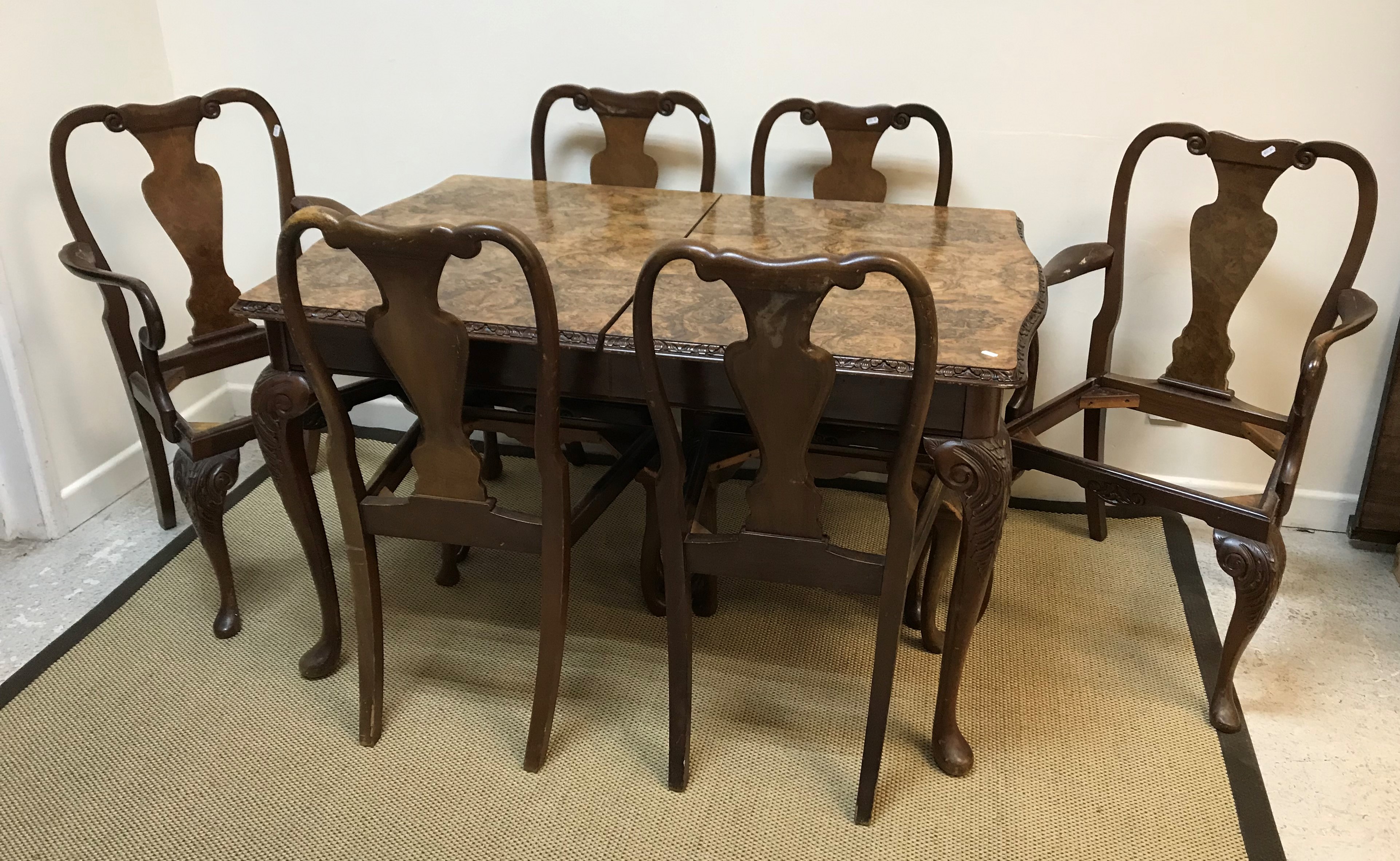 A late 20th Century walnut veneered extending dining table with single leaf,