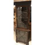 A mahogany freestanding corner cupboard