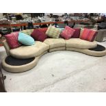 A modern Roche Bobois sofa of curved for