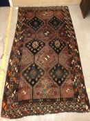 A Caucasian rug, the central panel set w