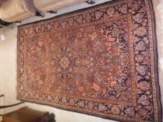 A Kashan rug, the central panel set with