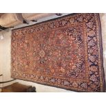 A Kashan rug, the central panel set with