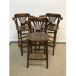 A set of three mahogany bentwood bar sto