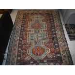 A Kazak carpet, the central panel set wi