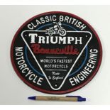 A modern painted cast metal sign "Triump